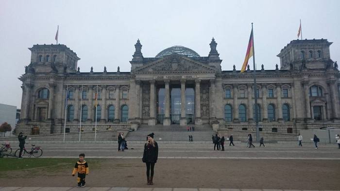 Travellers outside Reichstag building in berlin, Germany